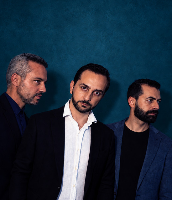 Posh: the three band members against a deep blue backdrop